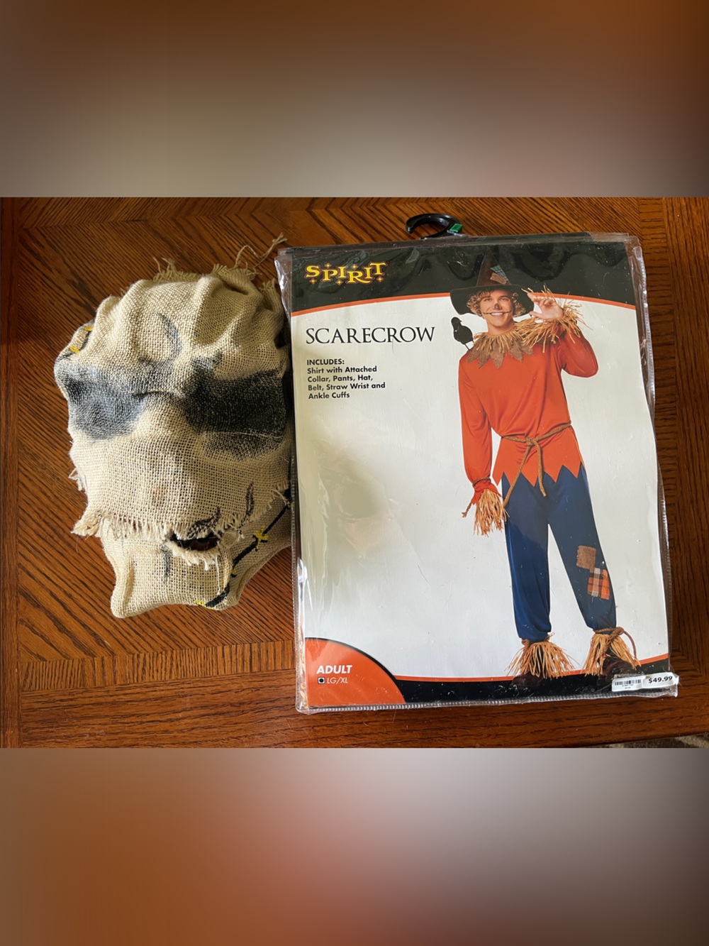 Spirit Halloween Scarecrow Costume with creepy moving Burlap Mask.